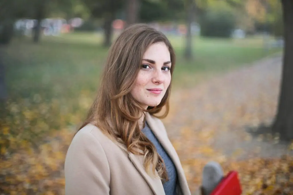 pexels-photo-712521-712521 A woman smiles in an autumn setting in Budapest, Hungary.